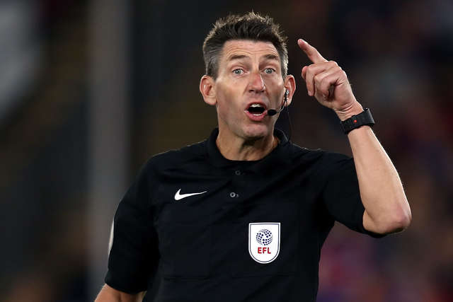 Lee Probert taking charge of a game.