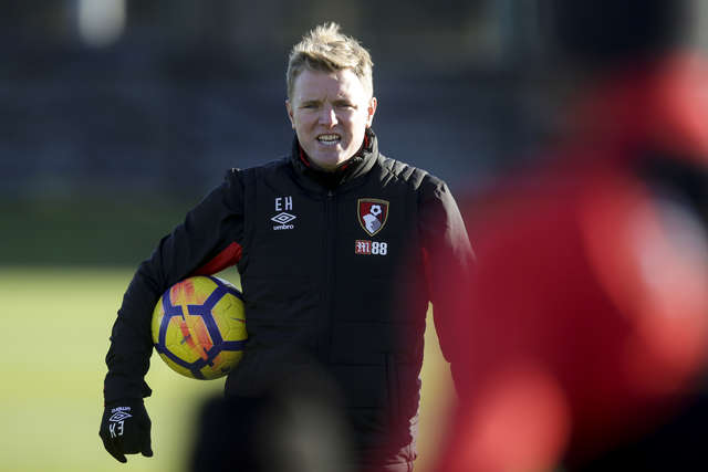 Eddie Howe in training with a ball in his hands.